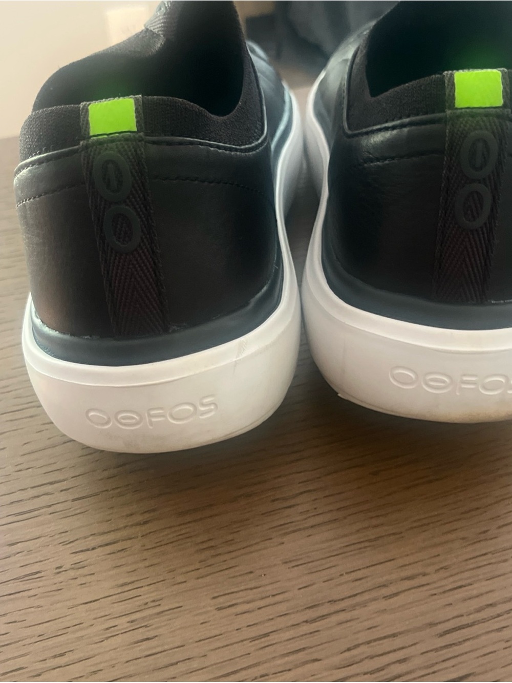 OOFOS Black Slip-On Loafers with White Sole and Neon Green Tab